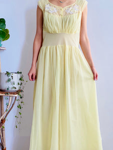 1960s Yellow sheer lingerie gown with embroidered flowers on model