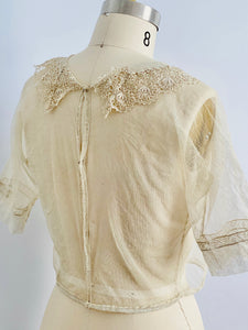back of a vintage 1920s chemical lace top on mannequin