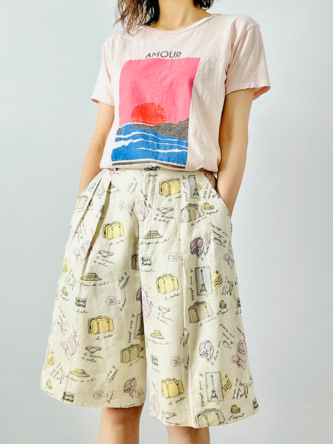 Vintage “travel essentials” novelty print linen shorts