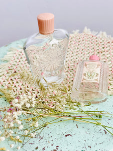Pair vintage pastel pink perfume bottles