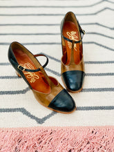 Load image into Gallery viewer, 1940s black and brown colors mary janes leather heels  on rug 
