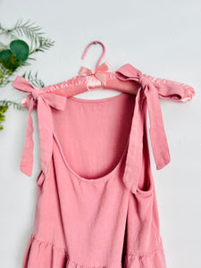 Pink ribbon tied cropped top