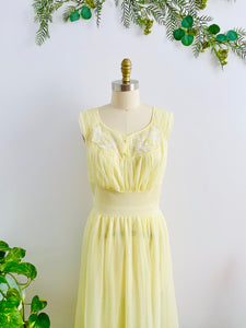 1960s Yellow sheer lingerie gown with embroidered flowers on mannequin