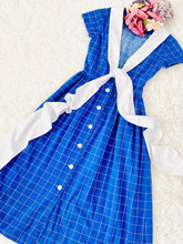 Load image into Gallery viewer, Vintage 1940s navy blue plaid dress with oversized ribbon bow
