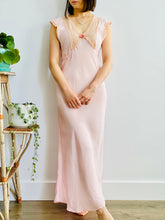 Load image into Gallery viewer, model wearing a vintage 1930s pink lingerie dress with lace and ribbon
