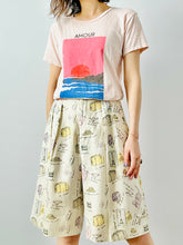 Load image into Gallery viewer, Vintage “travel essentials” novelty print linen shorts
