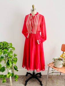 vintage 1970s red lace dress with peter pan collar on mannequin