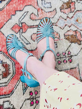 Load image into Gallery viewer, 1920s Turquoise color satin heels on model 

