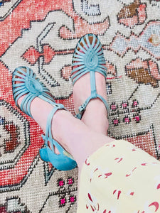 1920s Turquoise color satin heels on model 