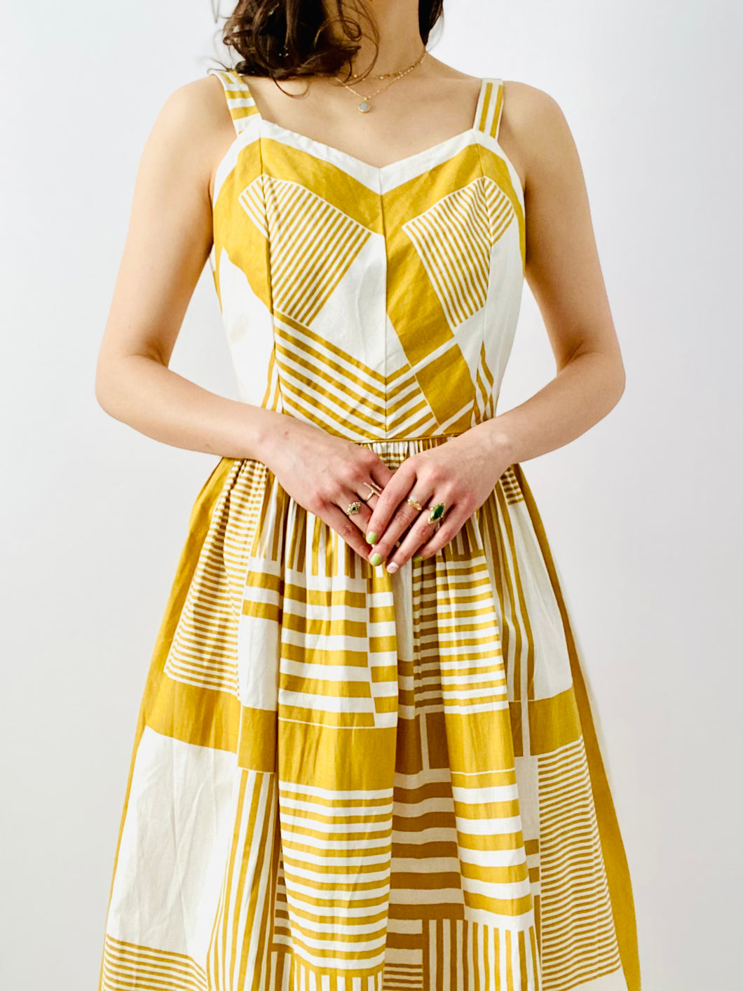 Vintage 1950s mustard color abstract print dress