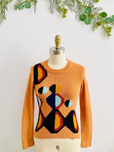 Load image into Gallery viewer, mannequin display a vintage orange color sweater with art deco pattern
