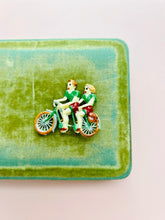 Load image into Gallery viewer, Vintage 1930s celluloid “cycling couple” novelty brooch
