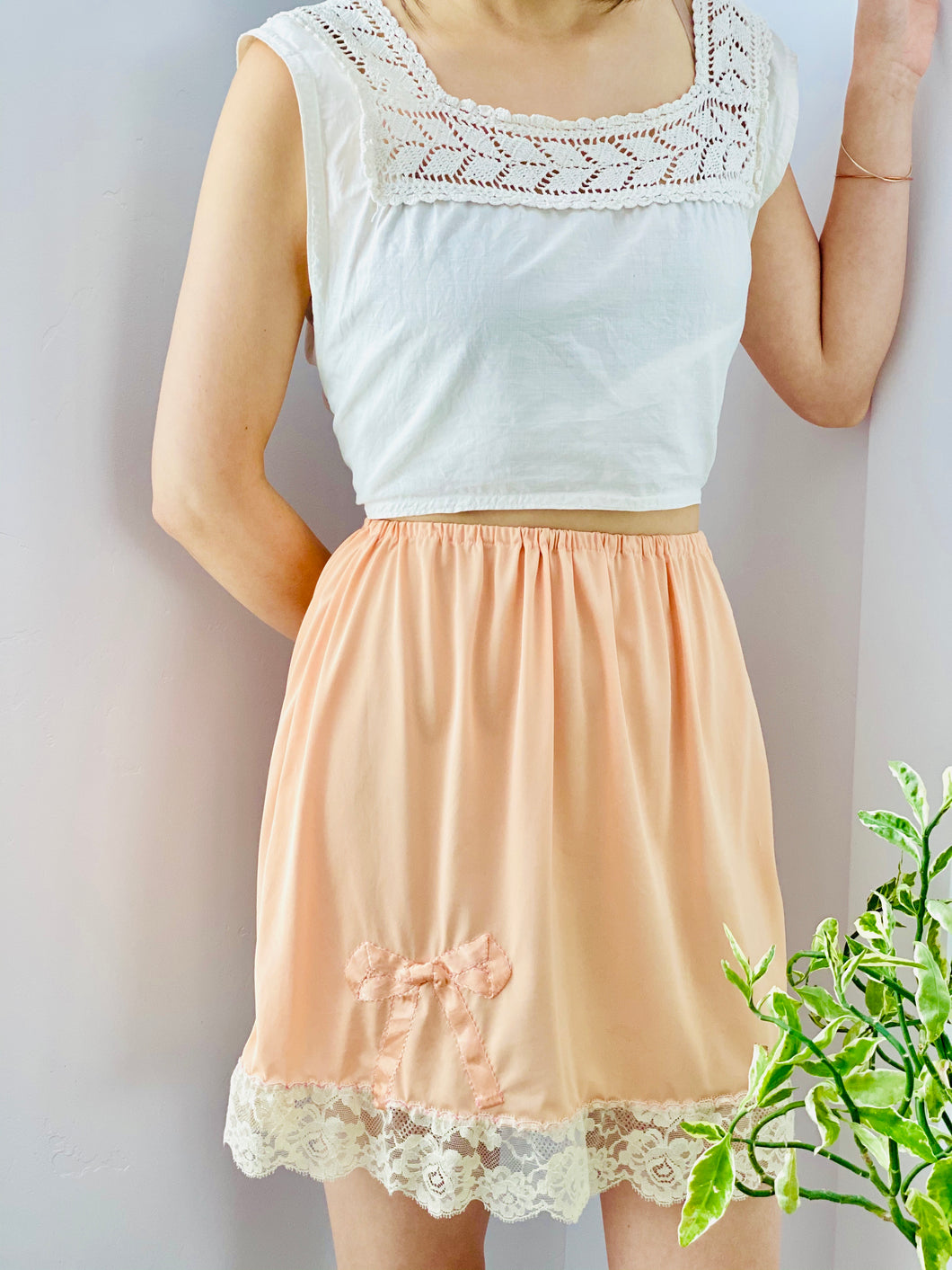 peach color 1930s nylon skirt on model 