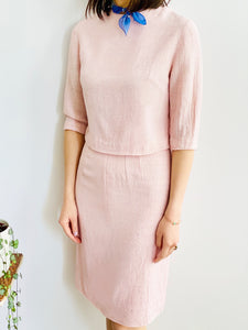 model wearing a 1940s pink linen two piece set with purple bandana