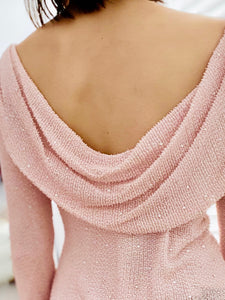 model wearing a low back beaded vintage pink top