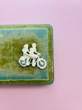 Load image into Gallery viewer, Vintage 1930s celluloid “cycling couple” novelty brooch
