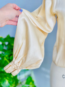 balloon sleeve of a satin blouse