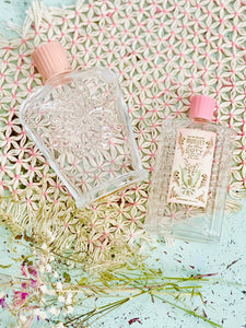 Pair vintage pastel pink perfume bottles