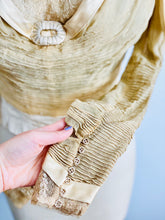 Load image into Gallery viewer, details of antique handmade buttons of pleated sleeves from an antique lace top
