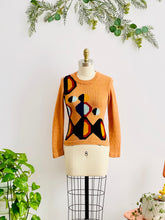 Load image into Gallery viewer, mannequin display a vintage orange color sweater with art deco pattern

