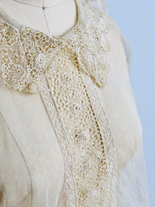 closeup of vintage 1920s chemical lace top on mannequin