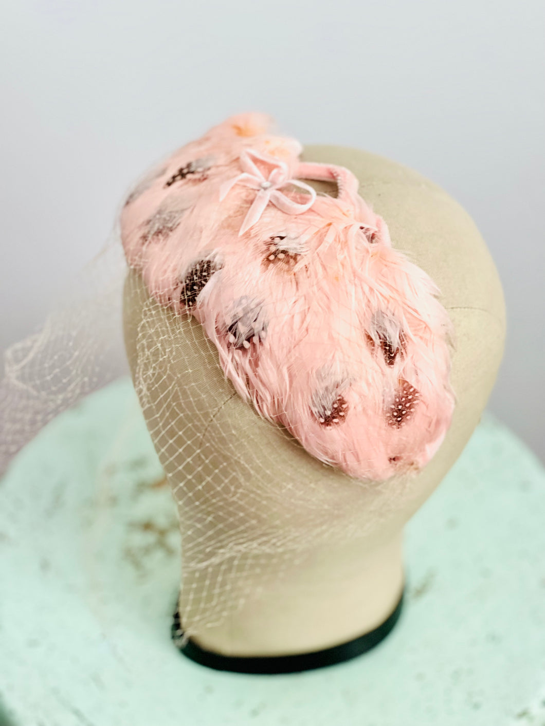 Vintage pink feather fascinator with veil bridal headpiece