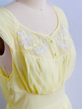 Load image into Gallery viewer, closeup of a 1960s Yellow sheer lingerie gown with embroidered flowers on mannequin
