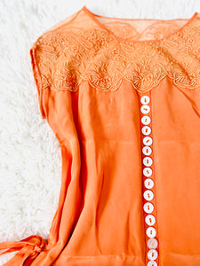 Vintage 1920s orange flapper dress