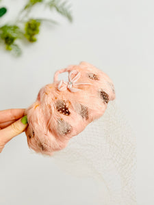 Vintage pink feather fascinator with veil bridal headpiece