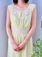Load image into Gallery viewer, 1960s Yellow sheer lingerie gown with embroidered flowers on model
