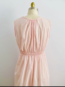 back of a vintage 1940s pink lingerie lace night gown on mannequin