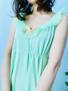 Vintage 1960s pastel green lingerie slip dress with ribbon
