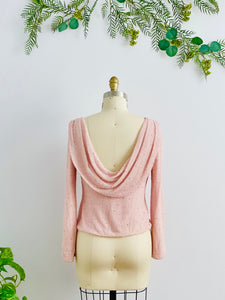 mannequin display a beaded vintage pink top with low back design
