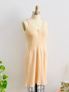 1920s peach color wool slip dress on mannequin