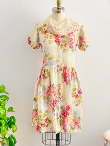 Vintage floral cotton dress with belt on mannequin