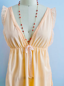 1960s peach color lace ribbon lingerie top on mannequin