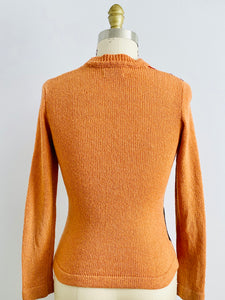 back side of a vintage orange sweater
