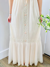 Load image into Gallery viewer, Skirt detail of a model wearing a white vintage Christian Dior lingerie dress with lace 

