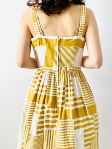 Vintage 1950s mustard color abstract print dress