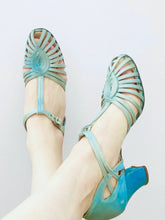 Load image into Gallery viewer, 1920s Turquoise color satin heels on model 
