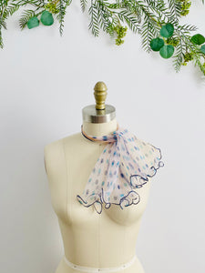mannequin display a 1940s ruffled polka dot scarf
