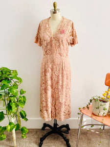 vintage 1940s pink lace dress with bubble pink brooch on mannequin