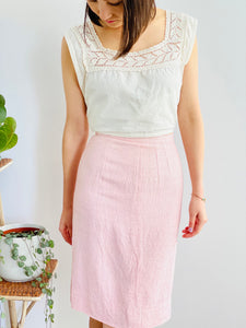 model wearing a 1910s lace top and 1940s pink linen skirt